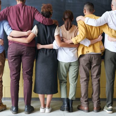 group of people standing indoors 3184396