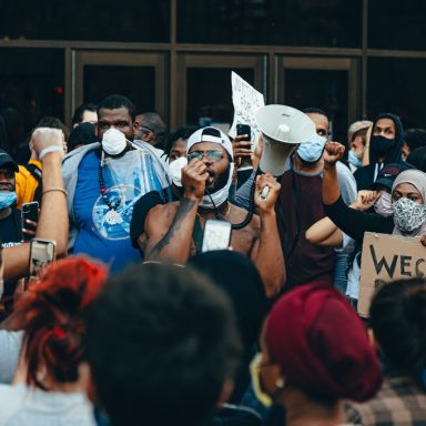 crowd of protesters holding signs 4508668