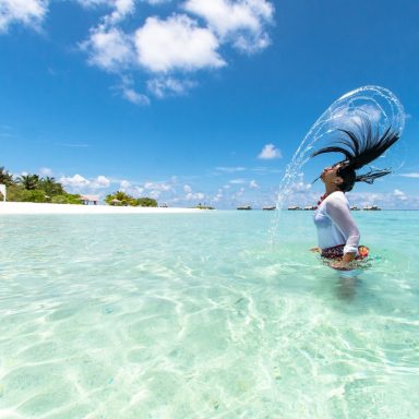 photo of woman half body submerged on body of water 1430673